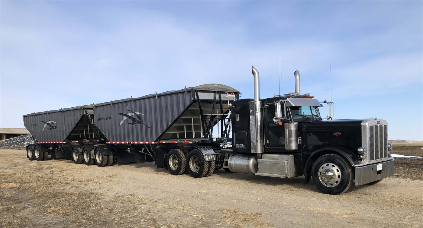 Super B truck hauling grain and commodities for Willow Mills
